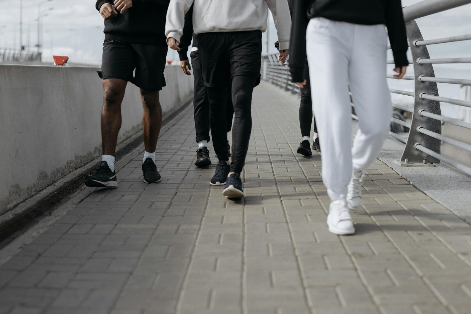 Man in his 40s walking outdoors at a relaxed pace
