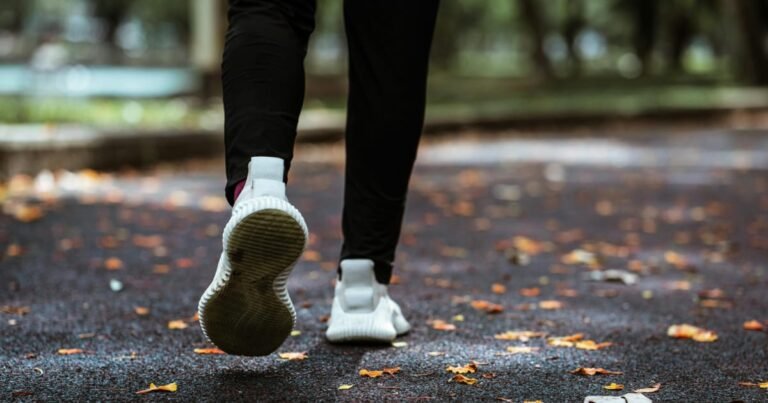 Man walking outdoors at a comfortable pace after 40