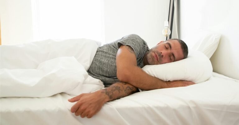 Man sleeping in dark bedroom focusing on sleep quality after 40