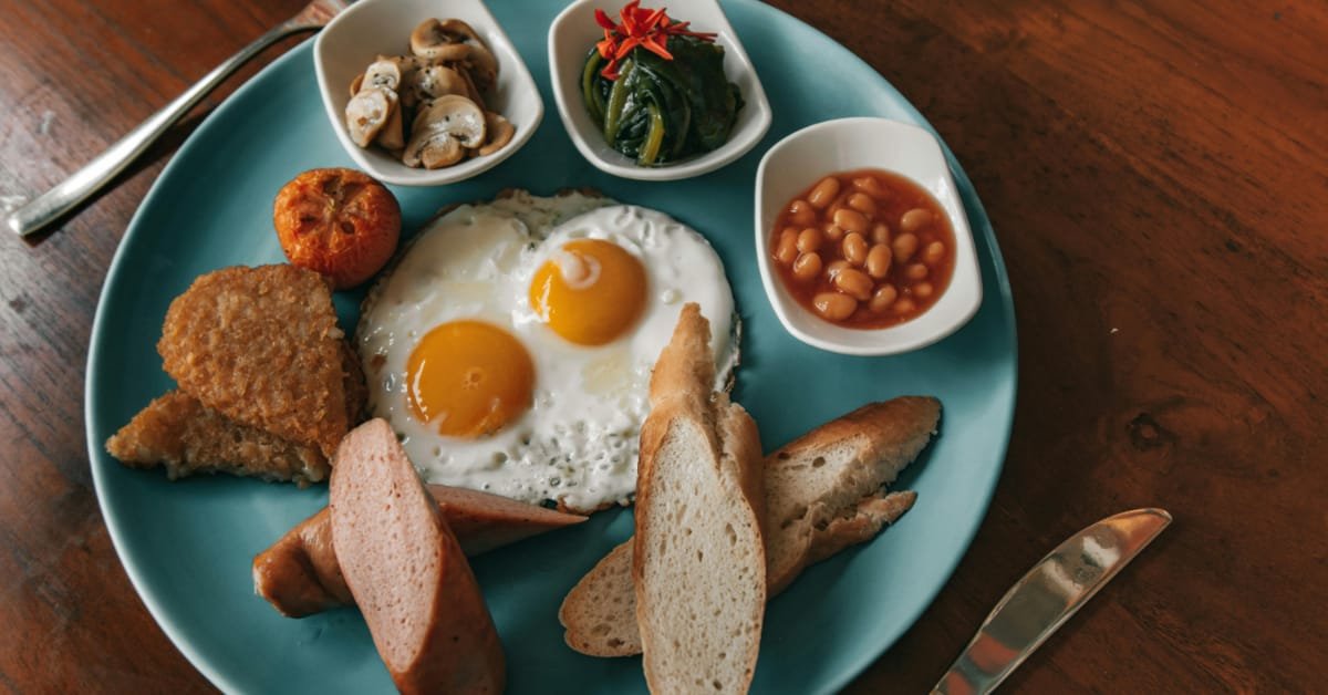 Protein rich food on a plate - Eggs, breads and beans