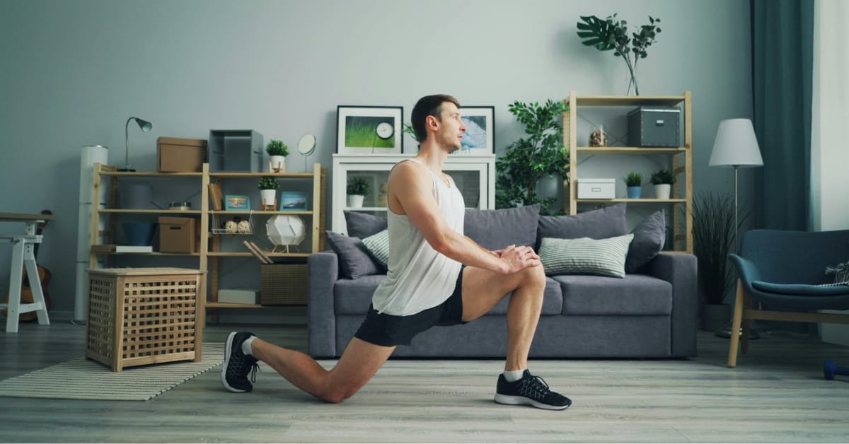 Man over 40 doing a morning knee stretch routine at home to reduce joint stiffness