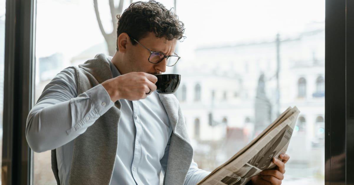 Man over 40 drinking his morning coffee before lunch, having cut afternoon caffeine for better sleep